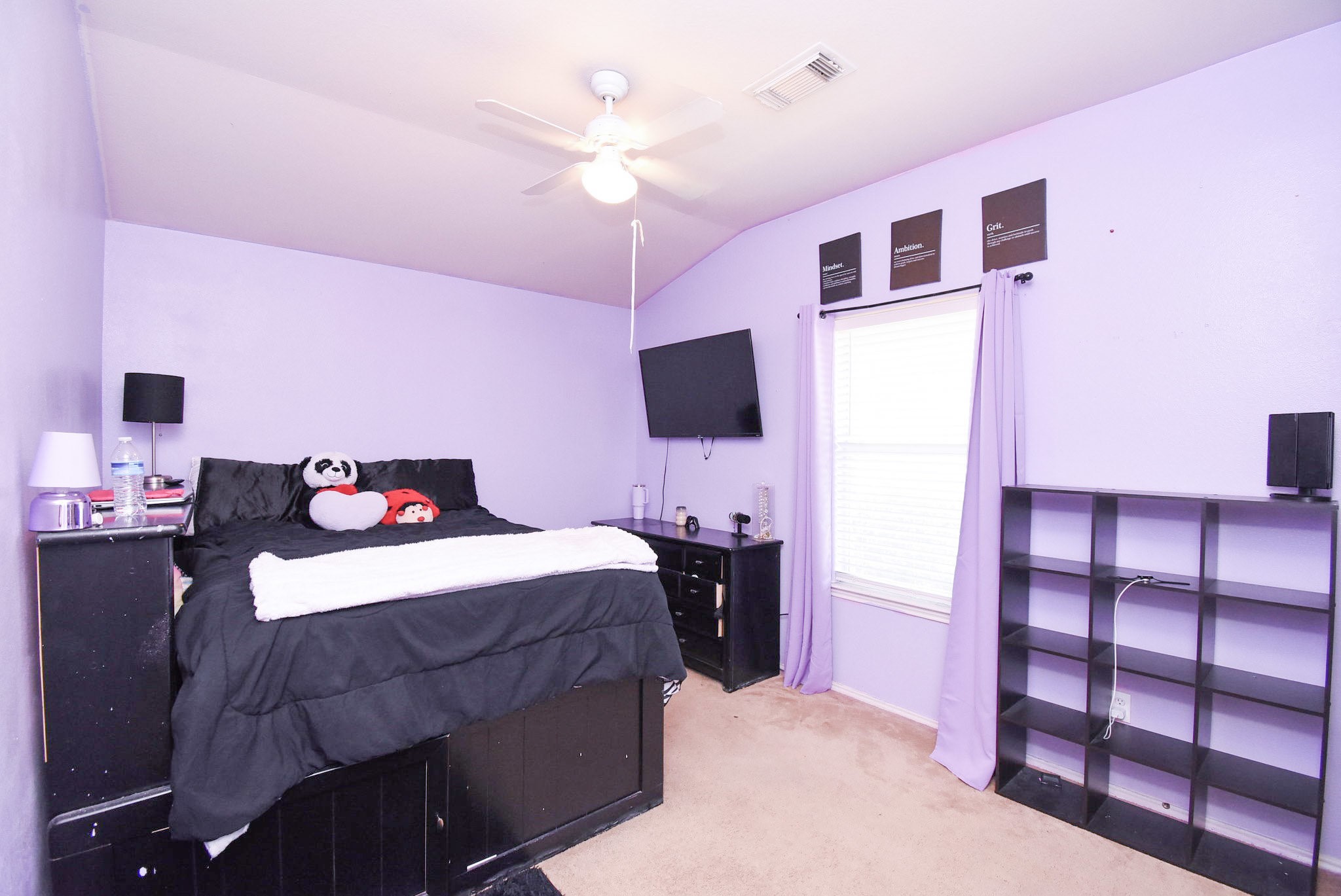 8502 Parapet Place Rosharon, TX 77583 - Photo 27 of 34 a bedroom with a bed and a flat screen tv