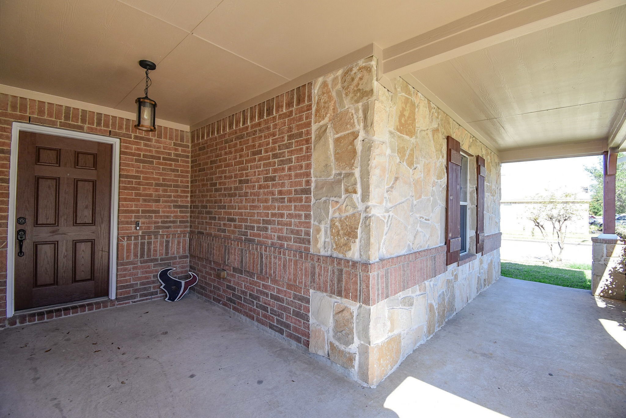 8502 Parapet Place Rosharon, TX 77583 - Photo 4 of 34 a view of a porch with wooden floor and outdoor space