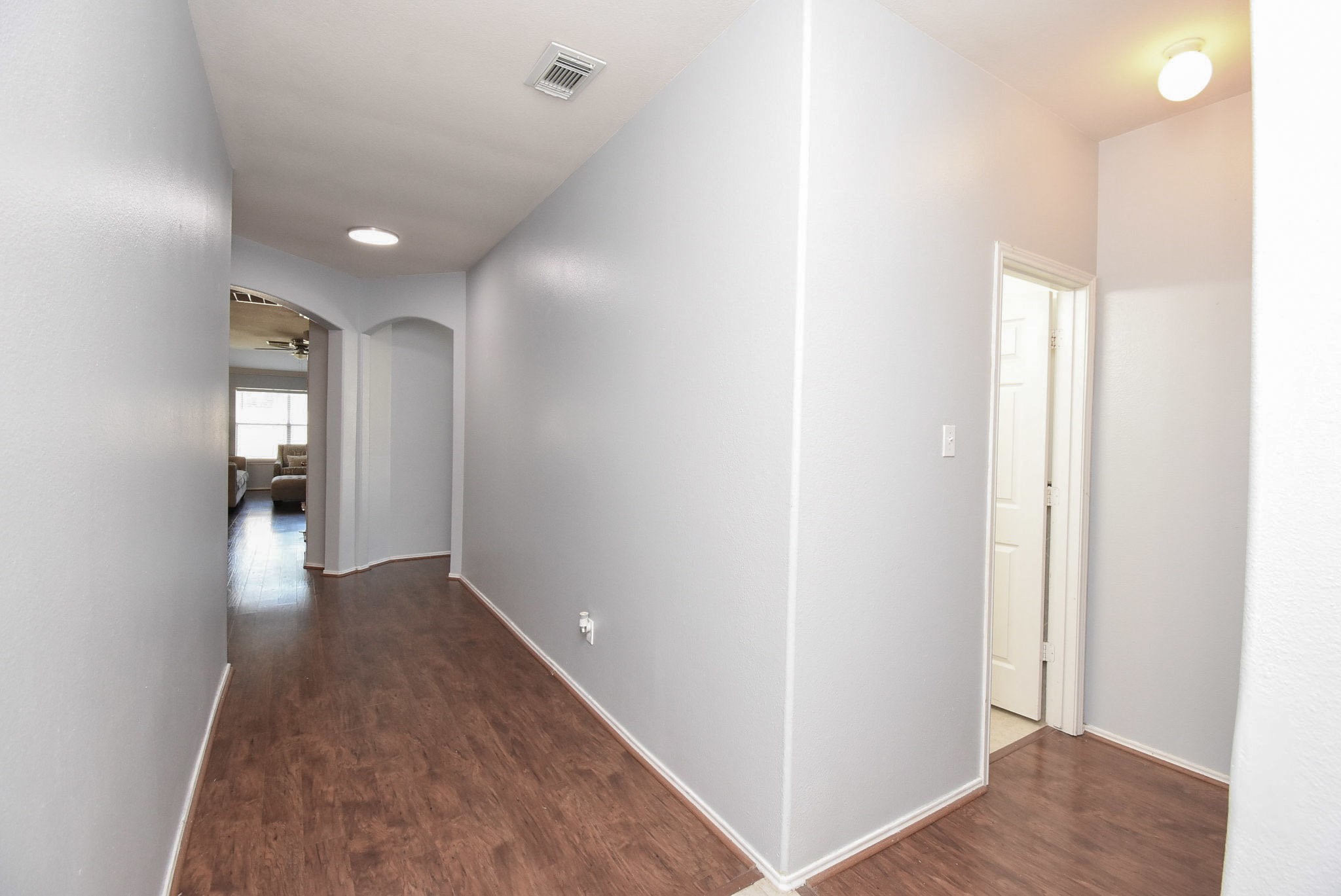 8502 Parapet Place Rosharon, TX 77583 - Photo 6 of 34 a view of a hallway with wooden floor