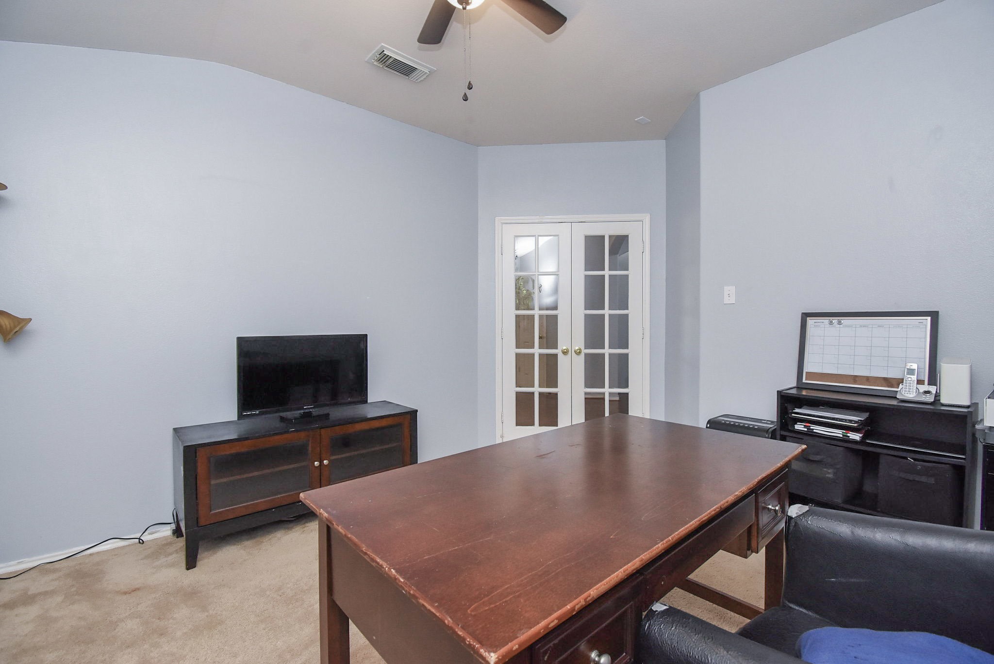 8502 Parapet Place Rosharon, TX 77583 - Photo 7 of 34 a view of a livingroom with furniture and a flat screen tv