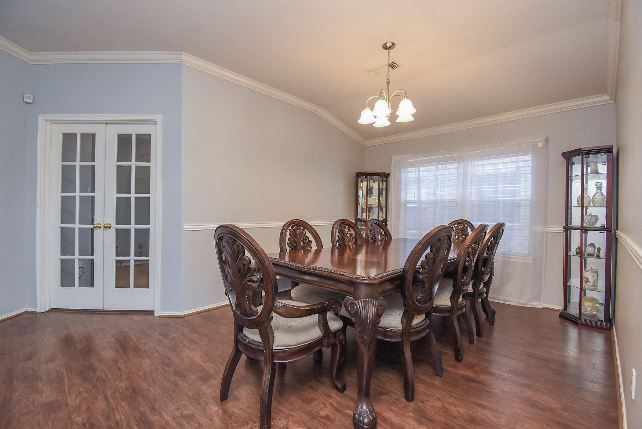 8502 Parapet Place Rosharon, TX 77583 - Photo 8 of 34 a view of a dining room with furniture and wooden floor