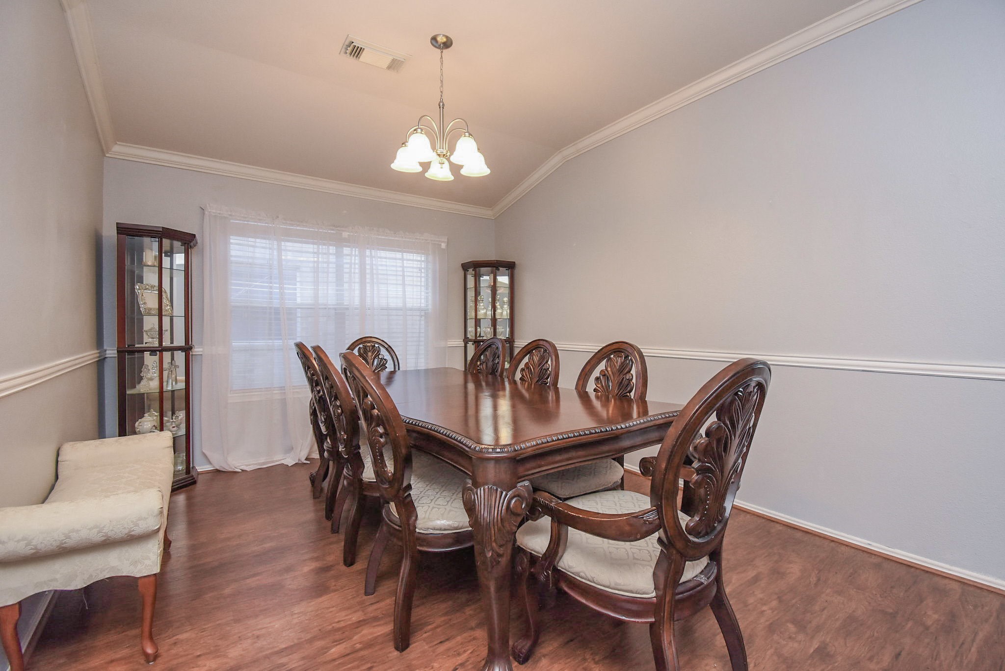 8502 Parapet Place Rosharon, TX 77583 - Photo 9 of 34 a view of a dining room with furniture and chandelier