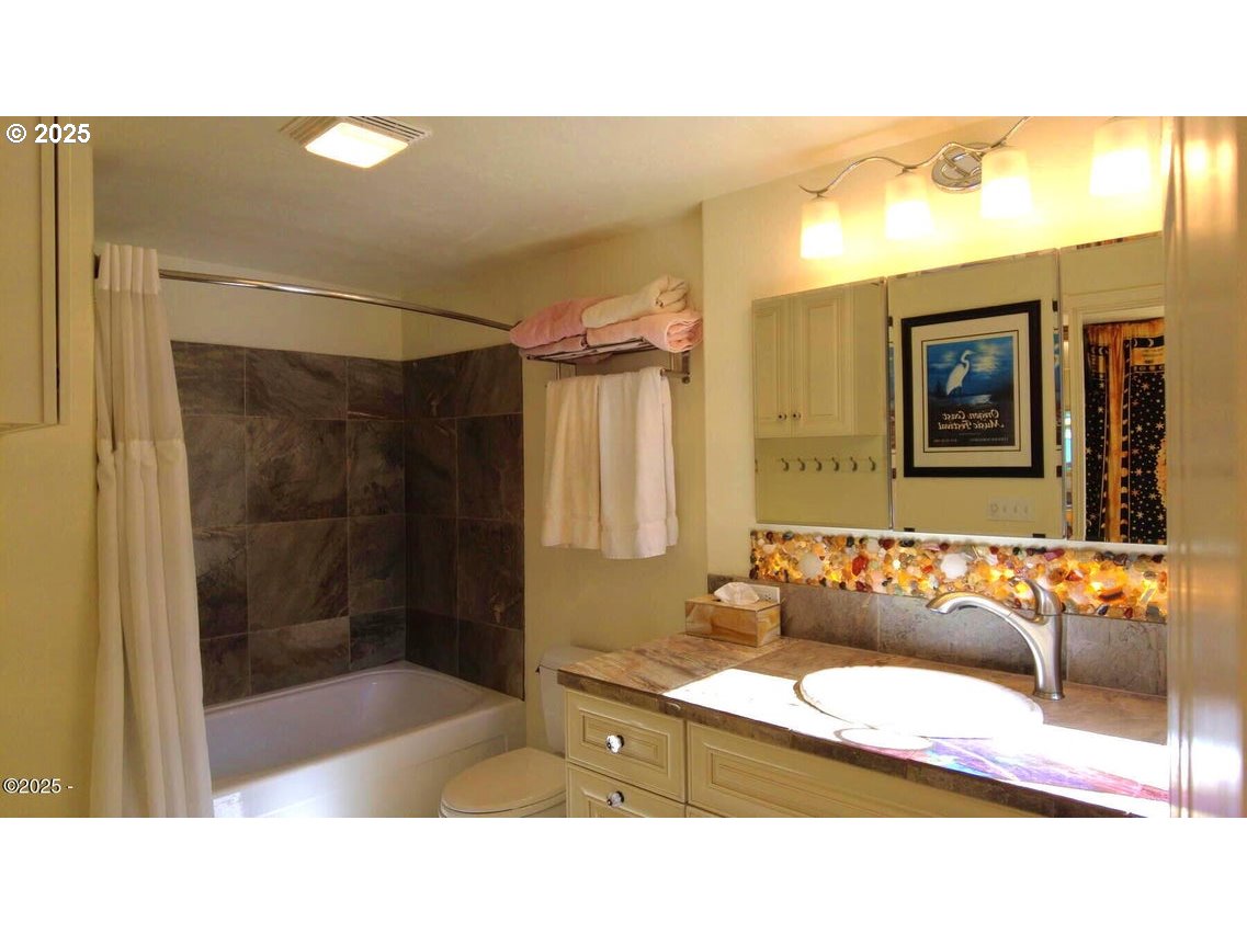 3512 Highway 101 Yachats, OR 97498 - Photo 15 of 39 a bathroom with a sink and a mirror