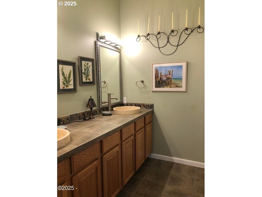 3512 Highway 101 Yachats, OR 97498 - Photo 23 of 39 a bathroom with a sink and a mirror