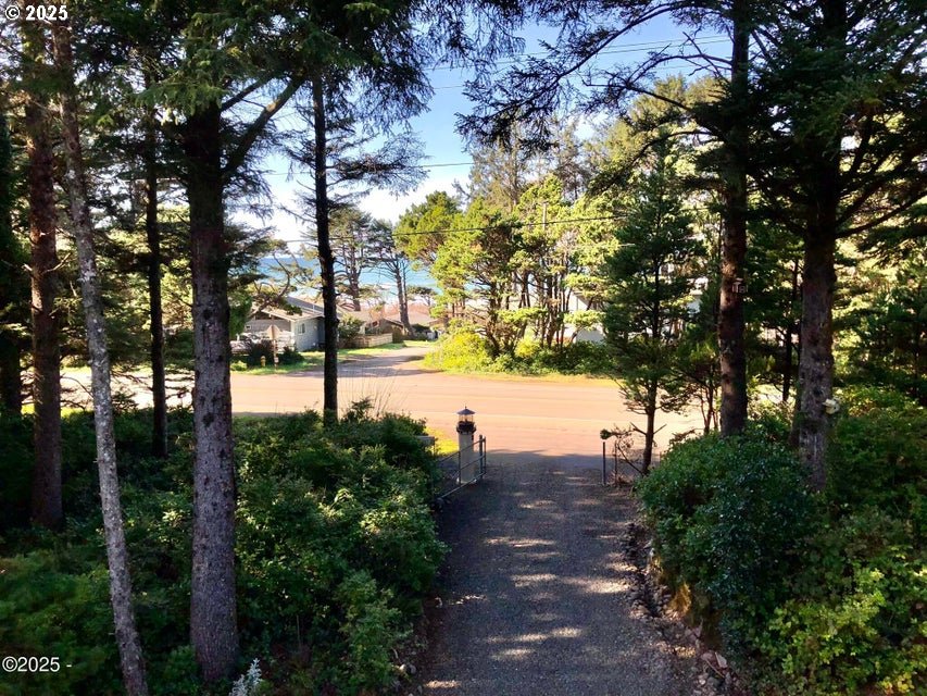 3512 Highway 101 Yachats, OR 97498 - Photo 32 of 39 a view of a street with large trees