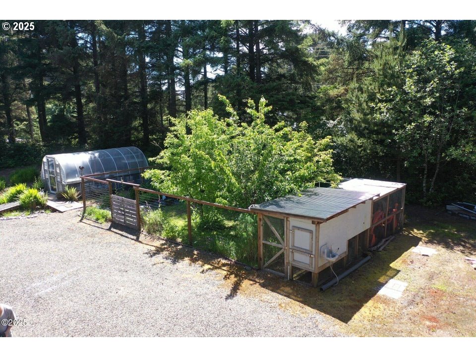 3512 Highway 101 Yachats, OR 97498 - Photo 33 of 39 a backyard of a house with table and chairs