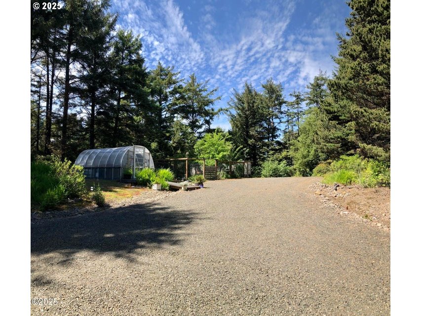 3512 Highway 101 Yachats, OR 97498 - Photo 37 of 39 a view of a street with a large trees