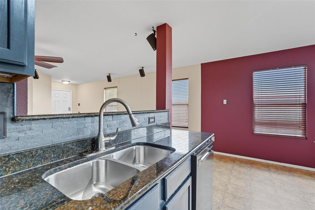 322 Laurel Lane Fate, TX 75087 - Photo 20 of 22 a kitchen with a sink cabinets and a window