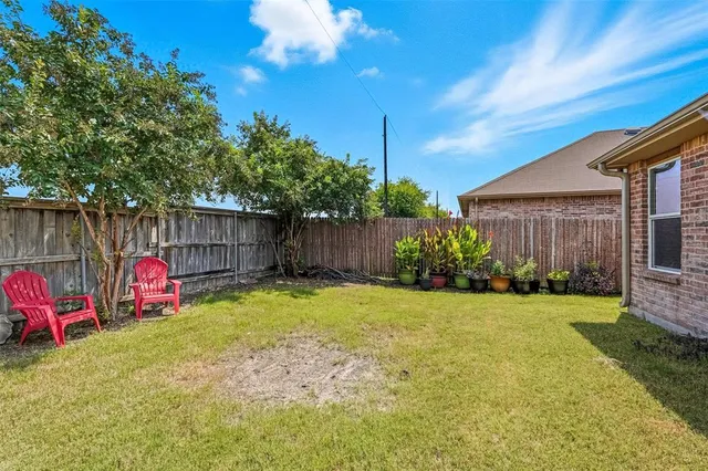 a view of backyard with green space