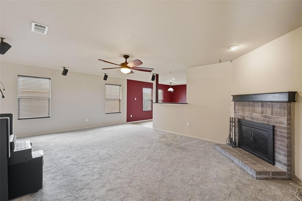 322 Laurel Lane Fate, TX 75087 - Photo 5 of 22 a view of a livingroom with a fireplace