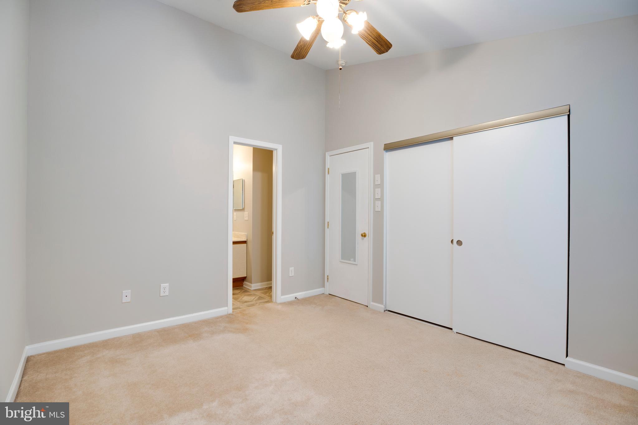 241 Coventry Square Sterling, VA 20164 - Photo 14 of 29 a view of an empty room with a chandelier fan