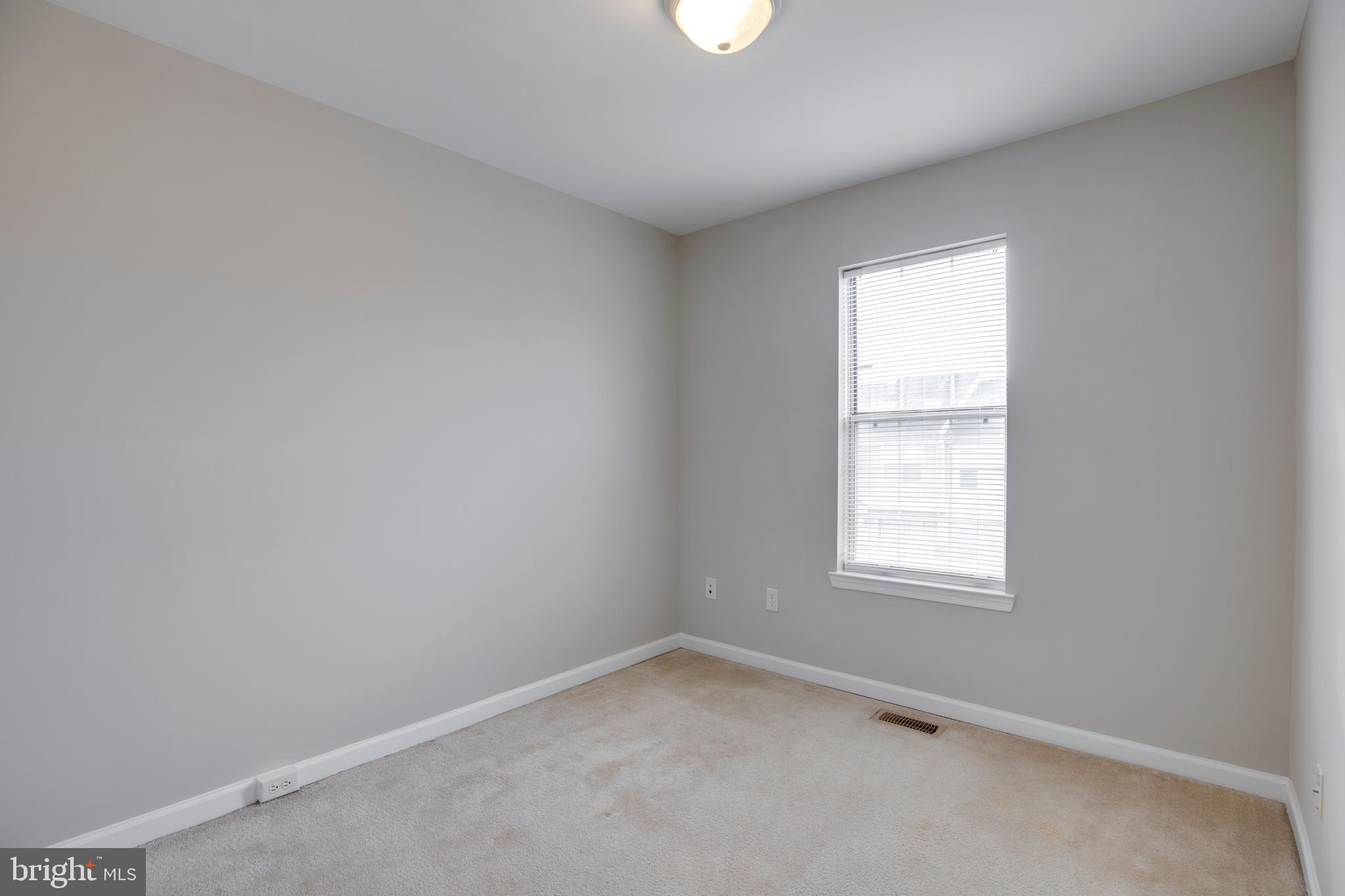 241 Coventry Square Sterling, VA 20164 - Photo 17 of 29 an empty room with a window