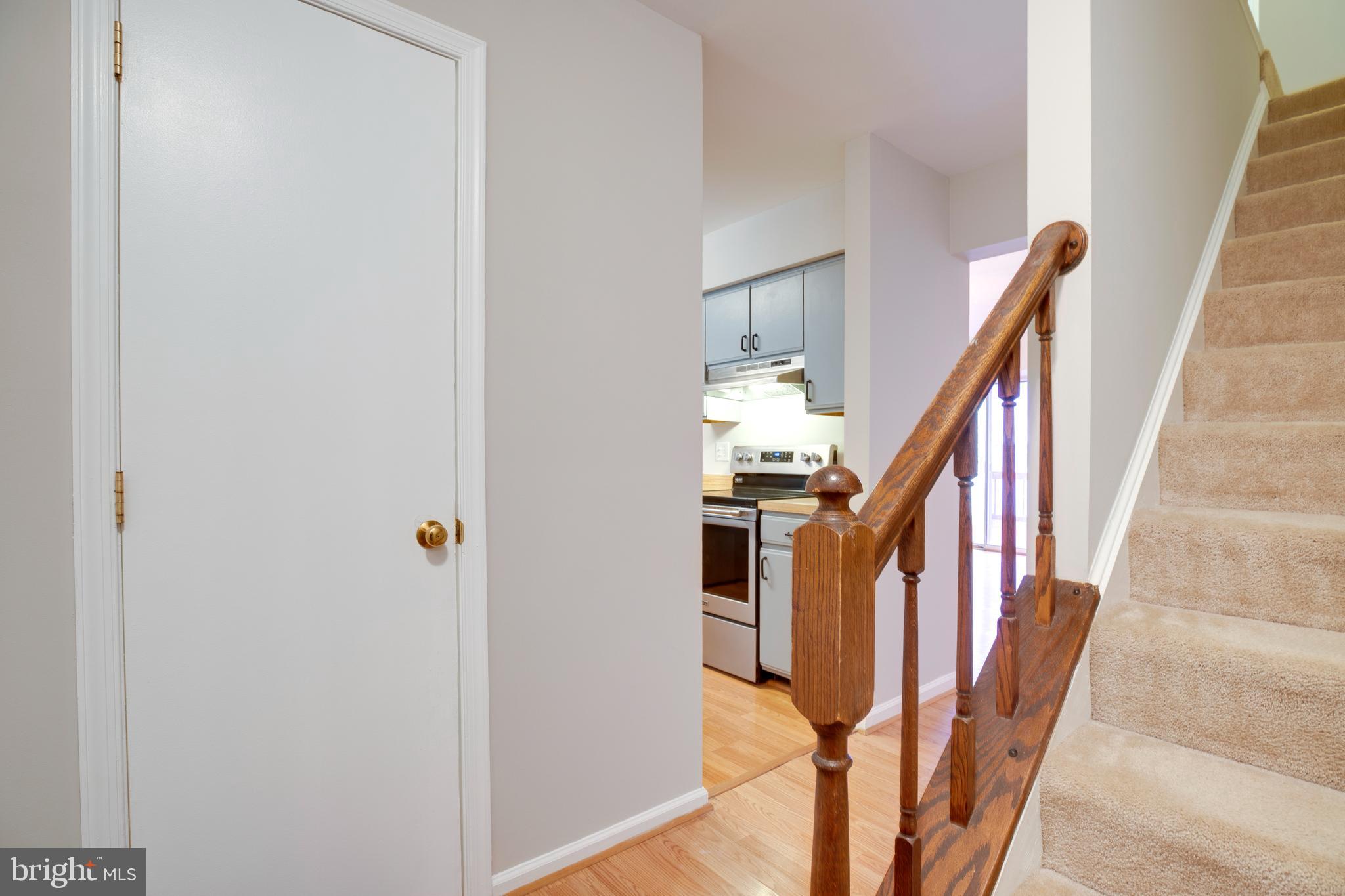 241 Coventry Square Sterling, VA 20164 - Photo 21 of 29 a view of staircase with lots of frames on wall and stairs