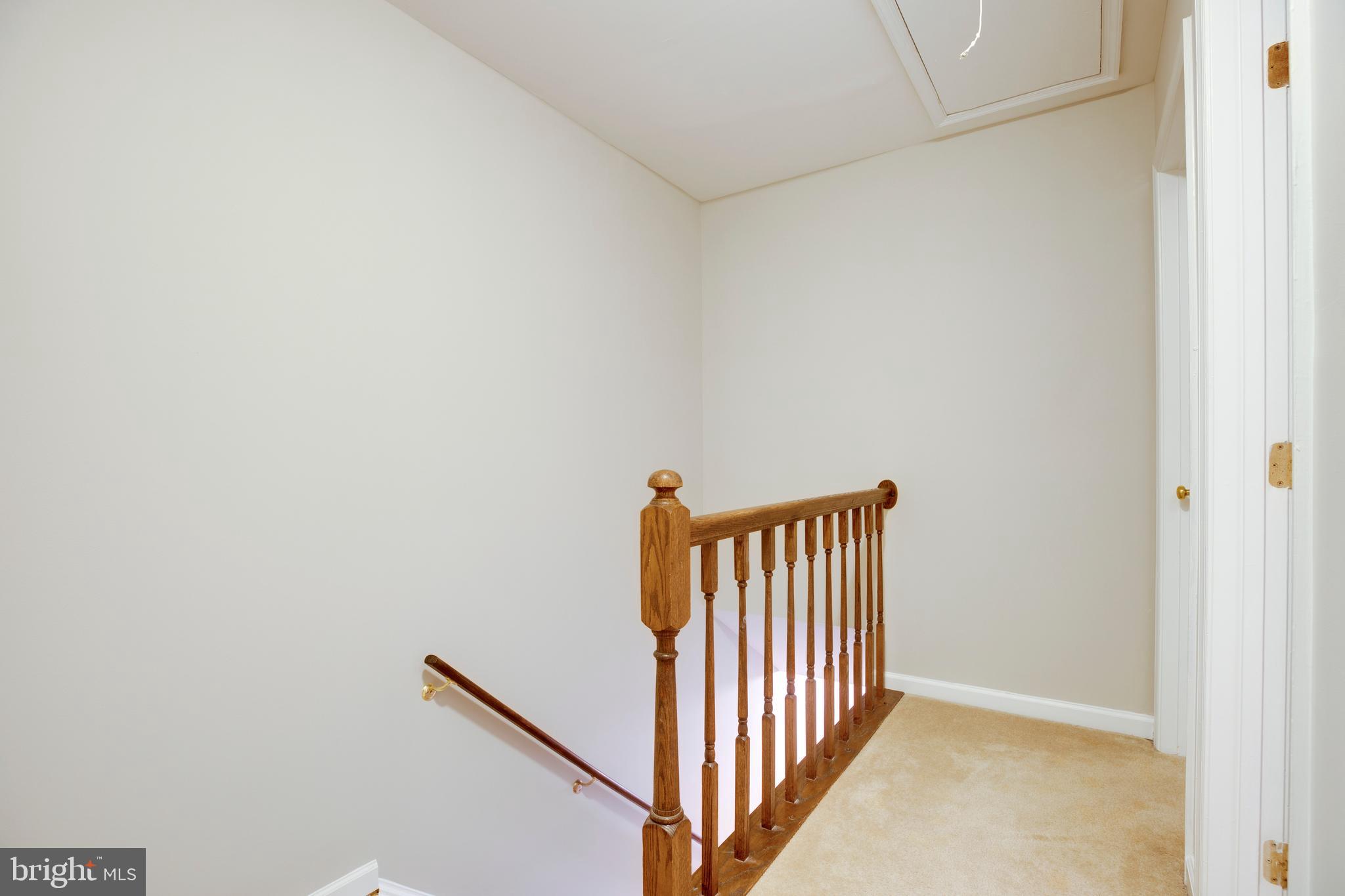241 Coventry Square Sterling, VA 20164 - Photo 23 of 29 a view of a hallway with wooden floor