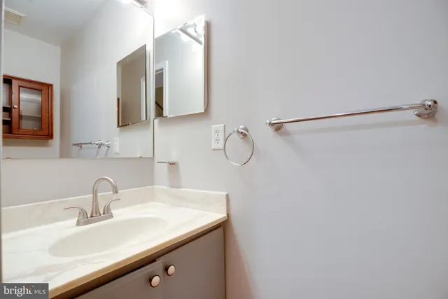 a bathroom with a sink and mirror