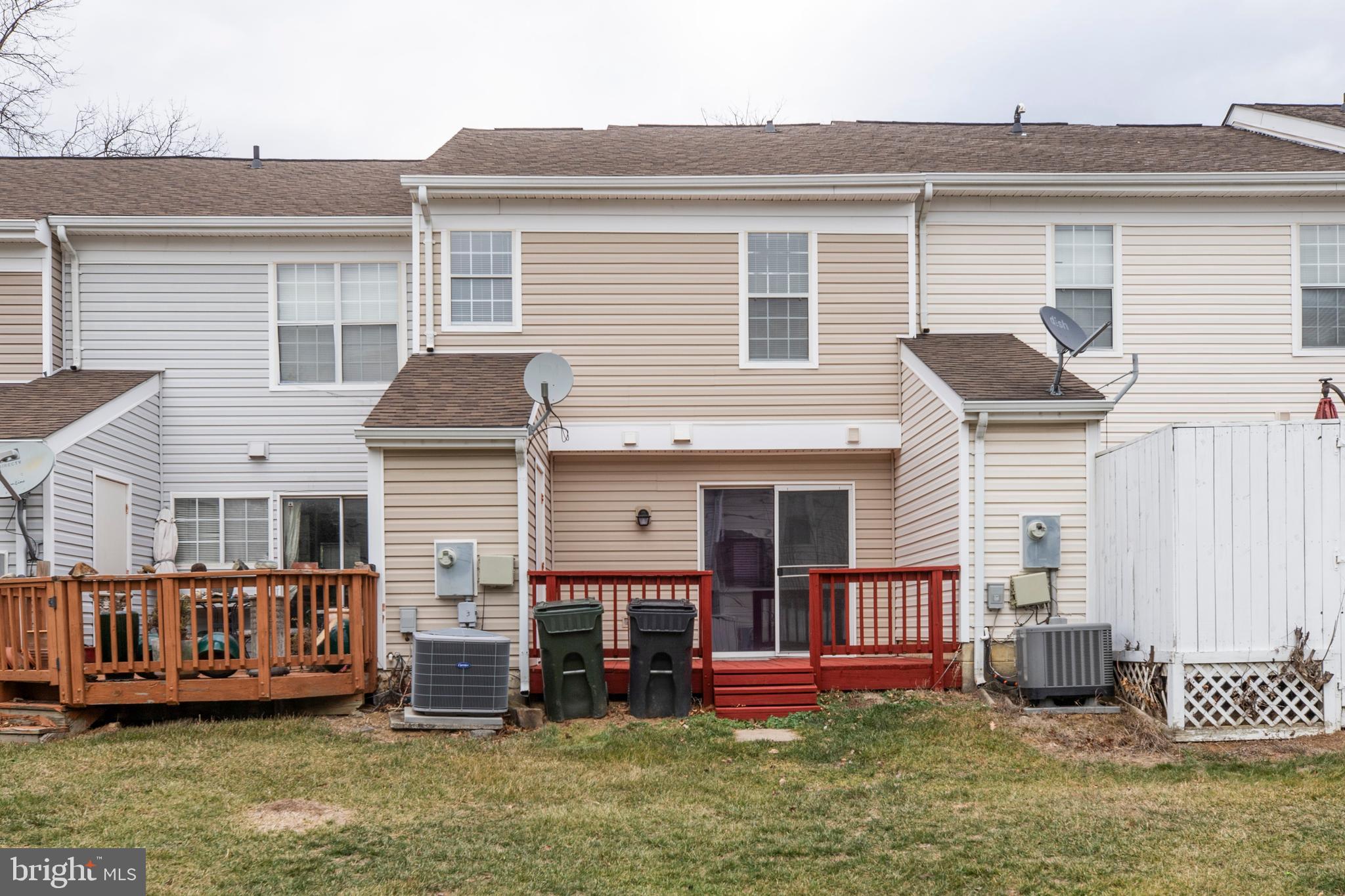 241 Coventry Square Sterling, VA 20164 - Photo 27 of 29 front view of a house with a yard