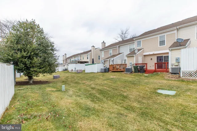 a front view of house with yard and trees