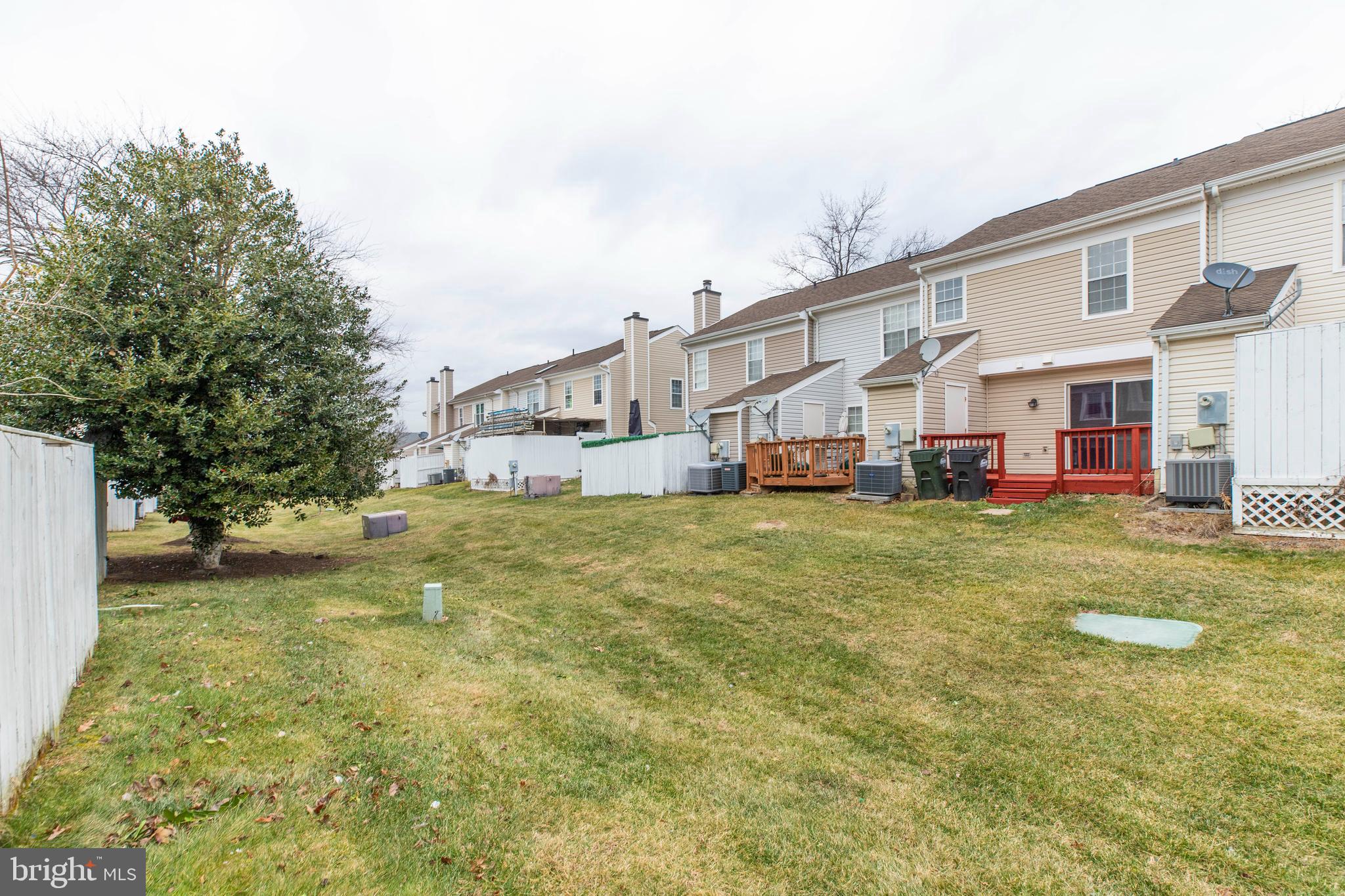 241 Coventry Square Sterling, VA 20164 - Photo 28 of 29 a front view of house with yard and trees