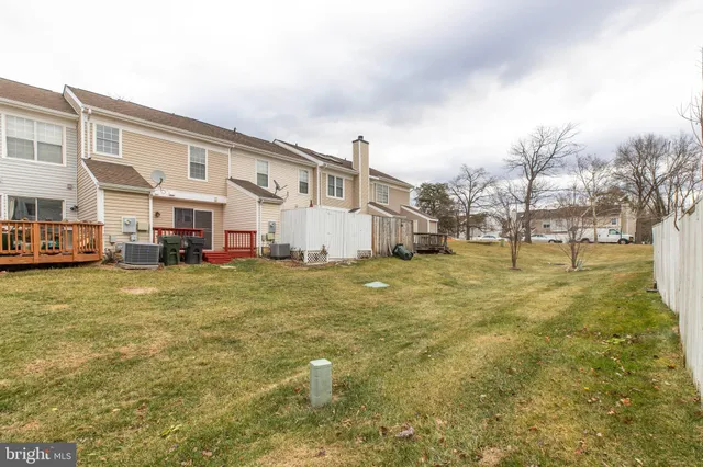 a view of a big yard with large trees