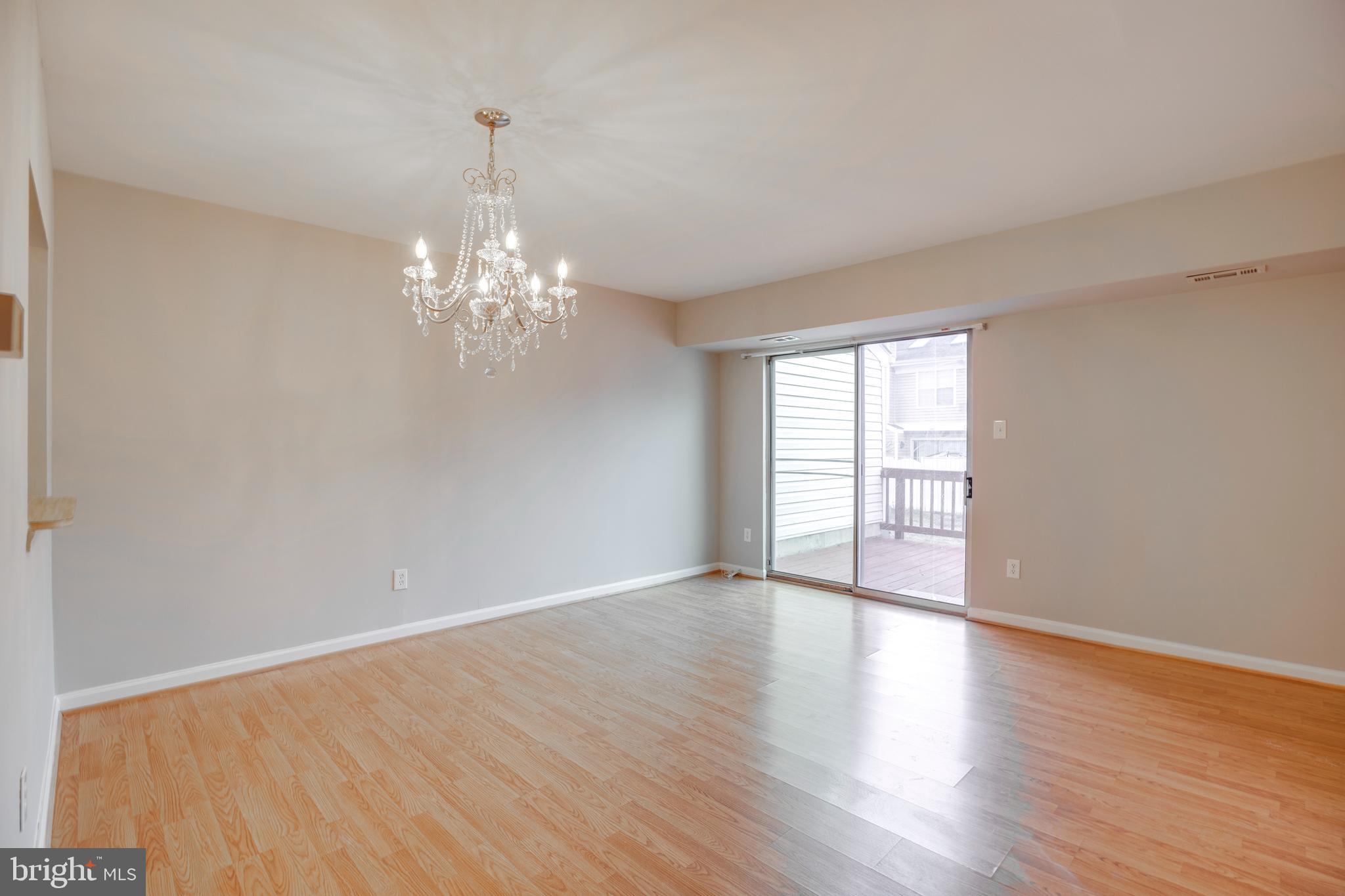 241 Coventry Square Sterling, VA 20164 - Photo 6 of 29 wooden floor in an empty room with a window