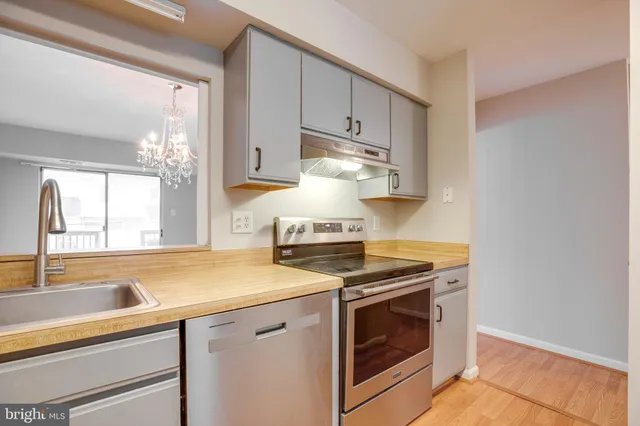 a kitchen with a stove and a sink
