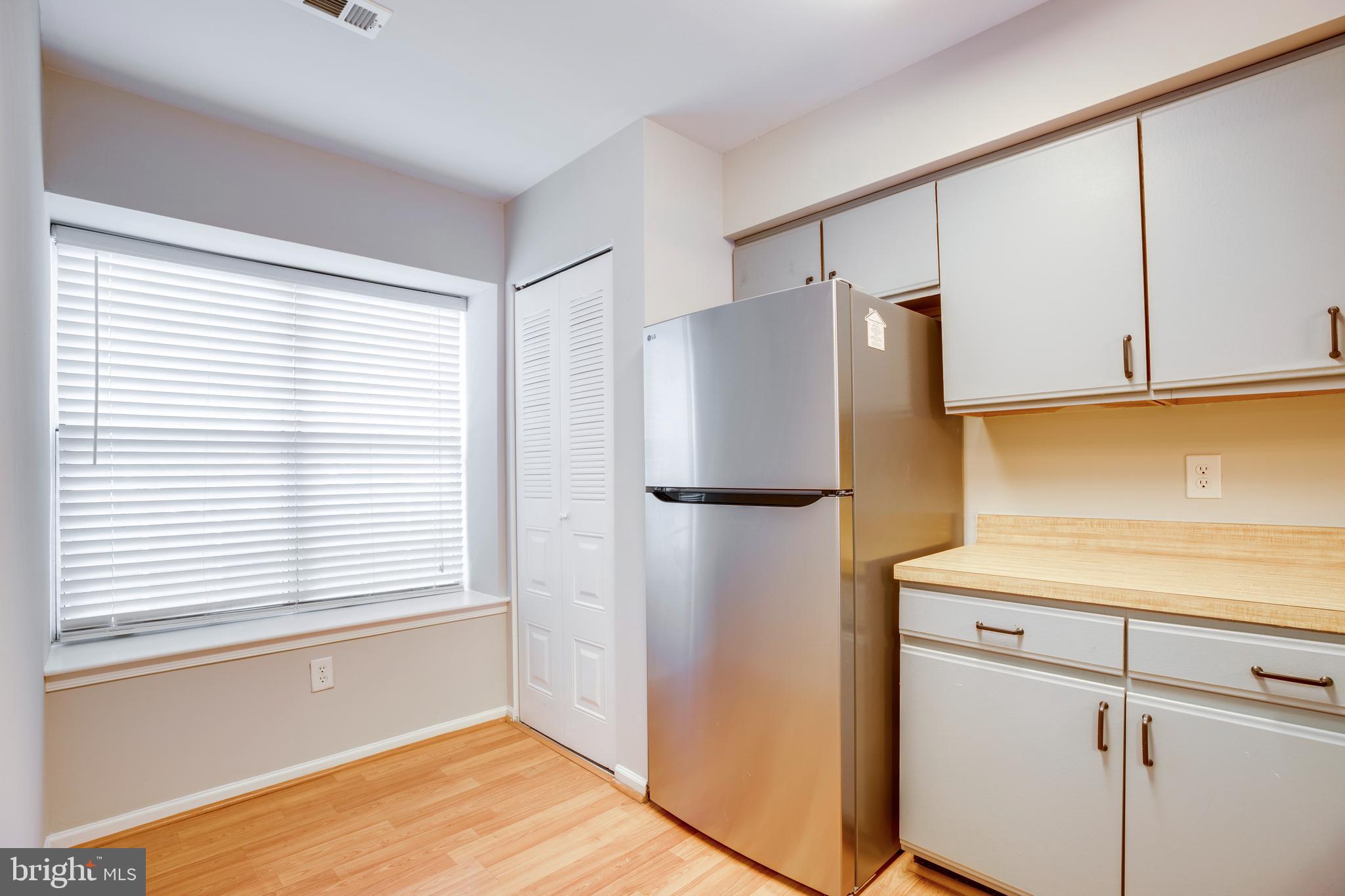241 Coventry Square Sterling, VA 20164 - Photo 9 of 29 a white refrigerator freezer sitting inside of a kitchen
