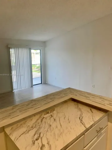 a view of room with wooden floor