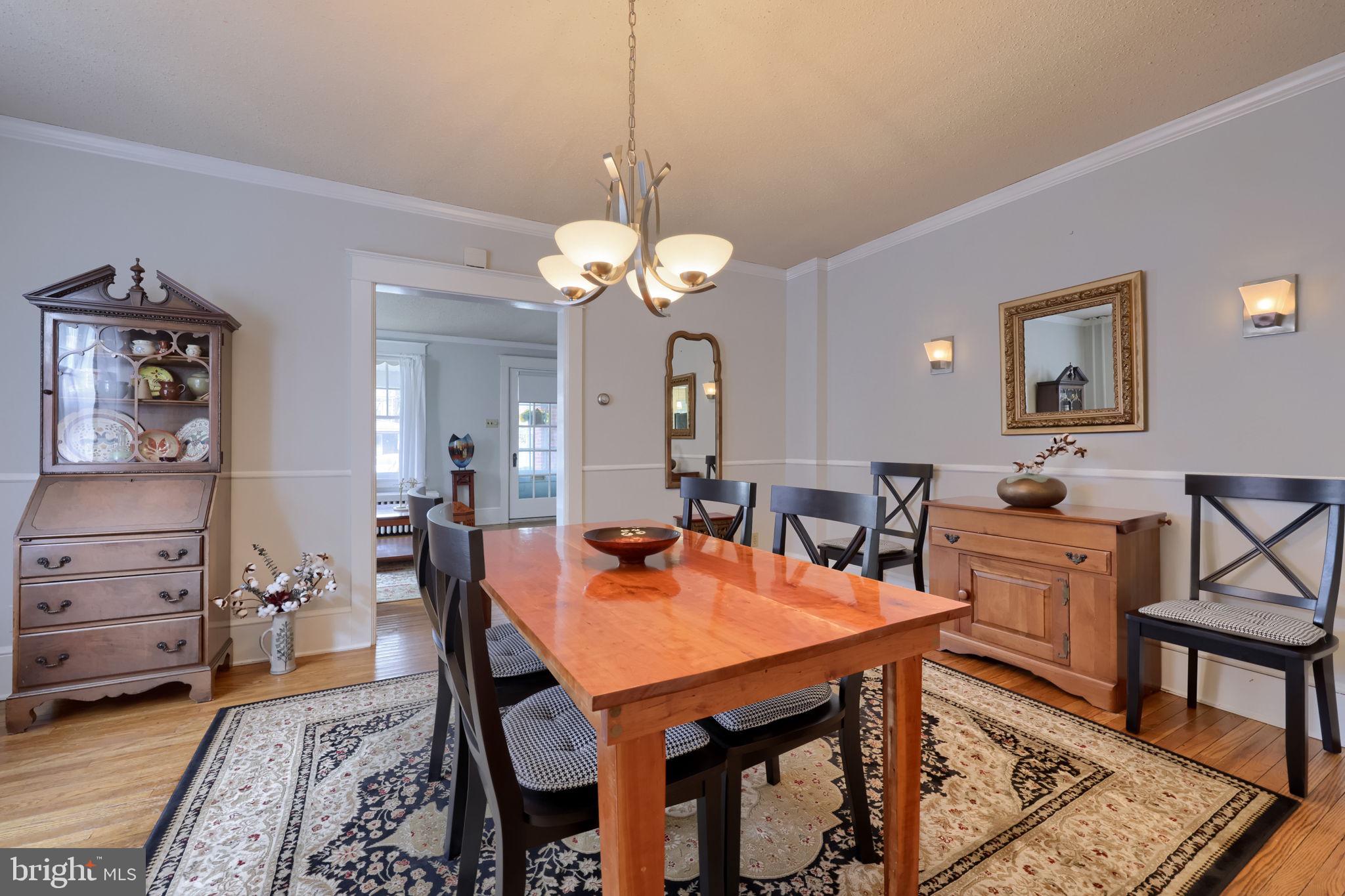 1013 Locust Street Columbia, PA 17512 - Photo 16 of 47 a view of a dining room with furniture and wooden floor