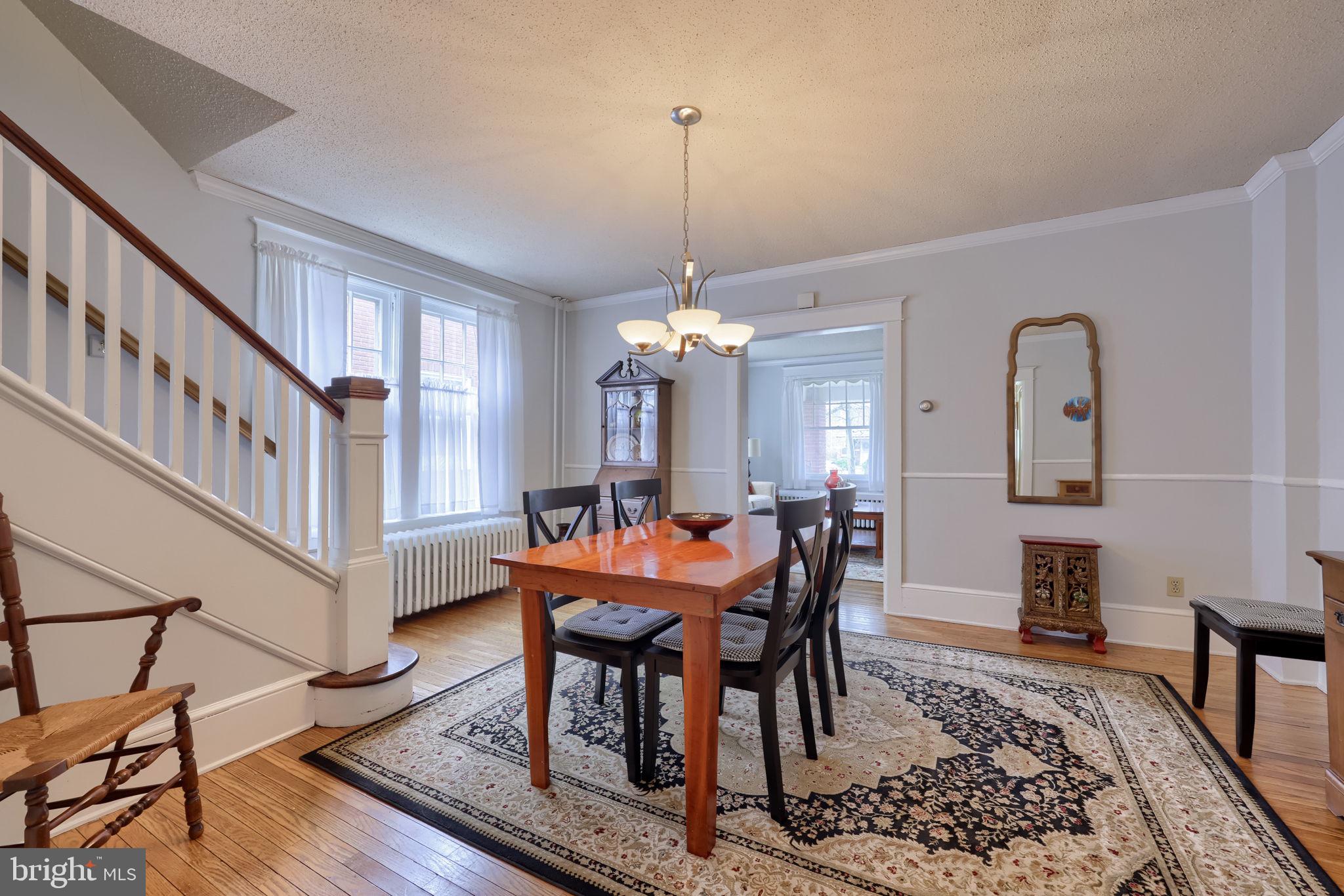 1013 Locust Street Columbia, PA 17512 - Photo 19 of 47 a dining room with furniture a chandelier and wooden floor
