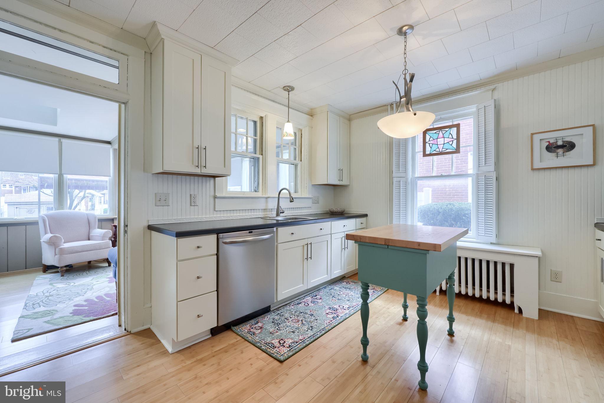 1013 Locust Street Columbia, PA 17512 - Photo 24 of 47 a kitchen with stainless steel appliances granite countertop a kitchen island hardwood floor sink stove dining table and chairs