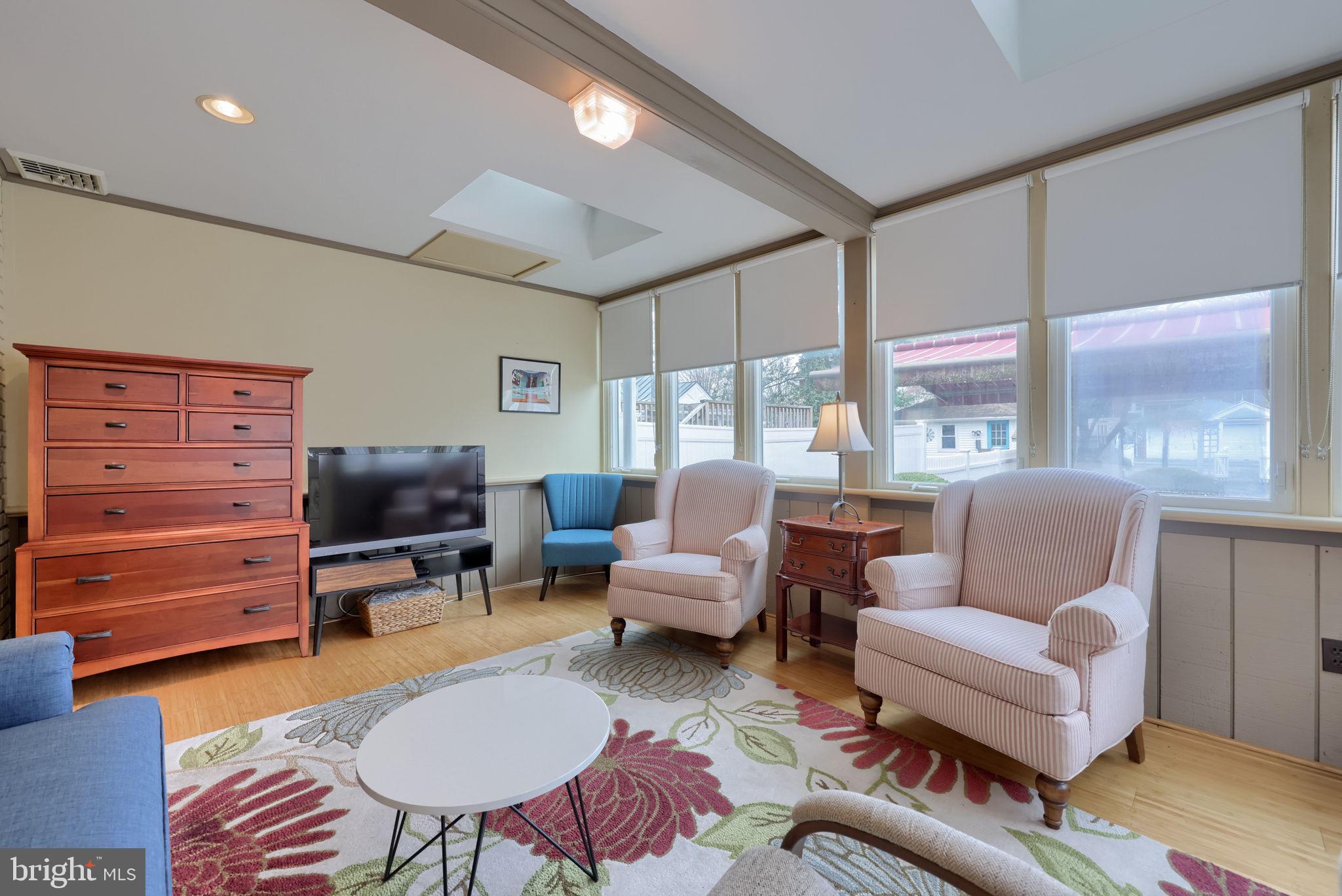 1013 Locust Street Columbia, PA 17512 - Photo 27 of 47 a living room with furniture a large window and a flat screen tv
