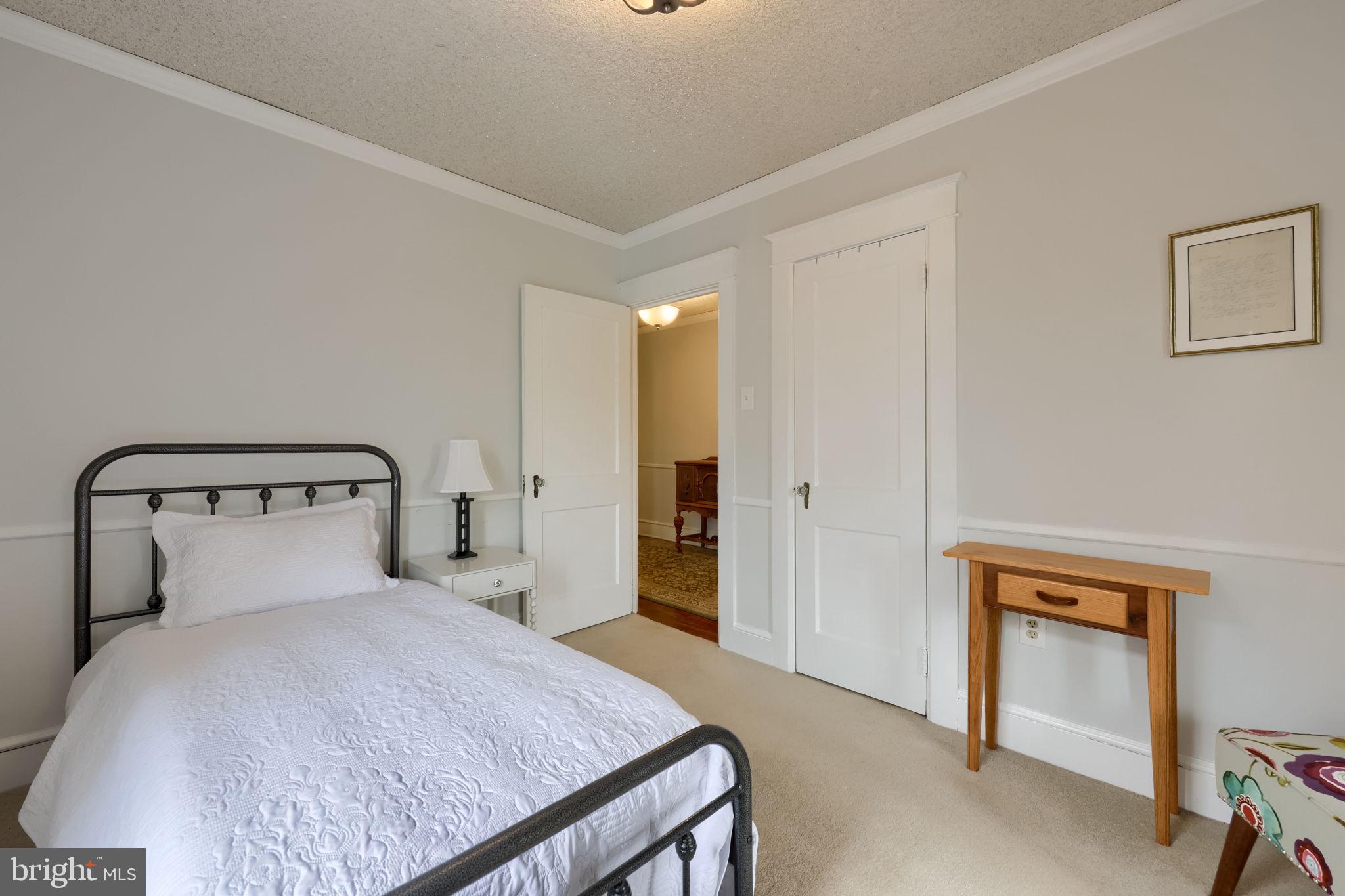 1013 Locust Street Columbia, PA 17512 - Photo 37 of 47 a bedroom with a bed and a lamp