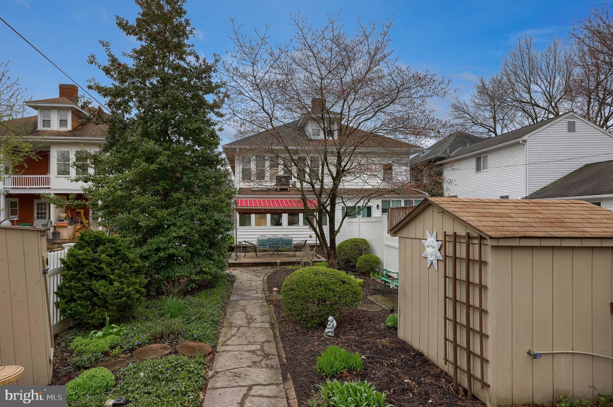 1013 Locust Street Columbia, PA 17512 - Photo 6 of 47 a yellow house with outdoor space