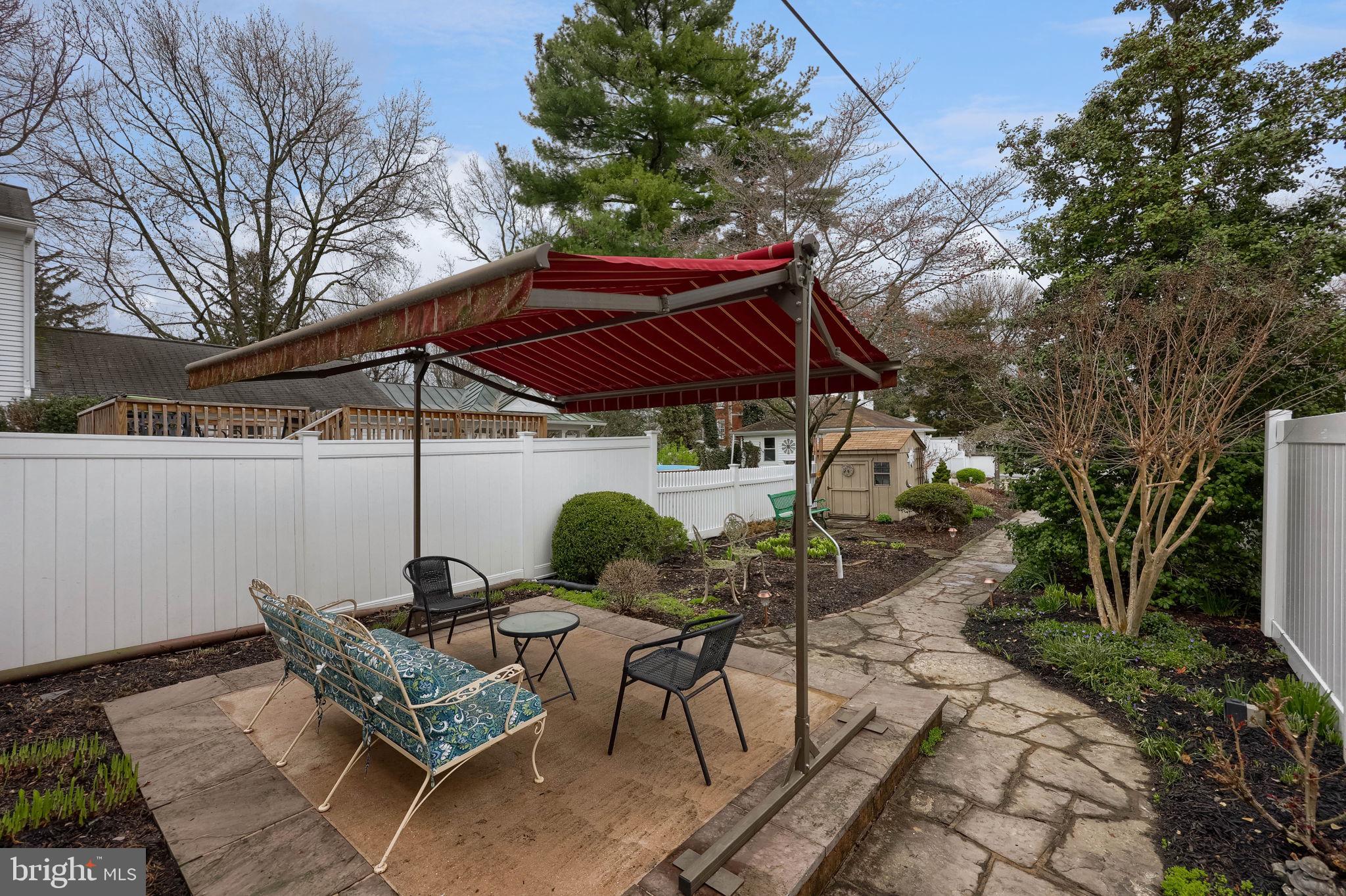 1013 Locust Street Columbia, PA 17512 - Photo 7 of 47 a patio with a patio table and chairs
