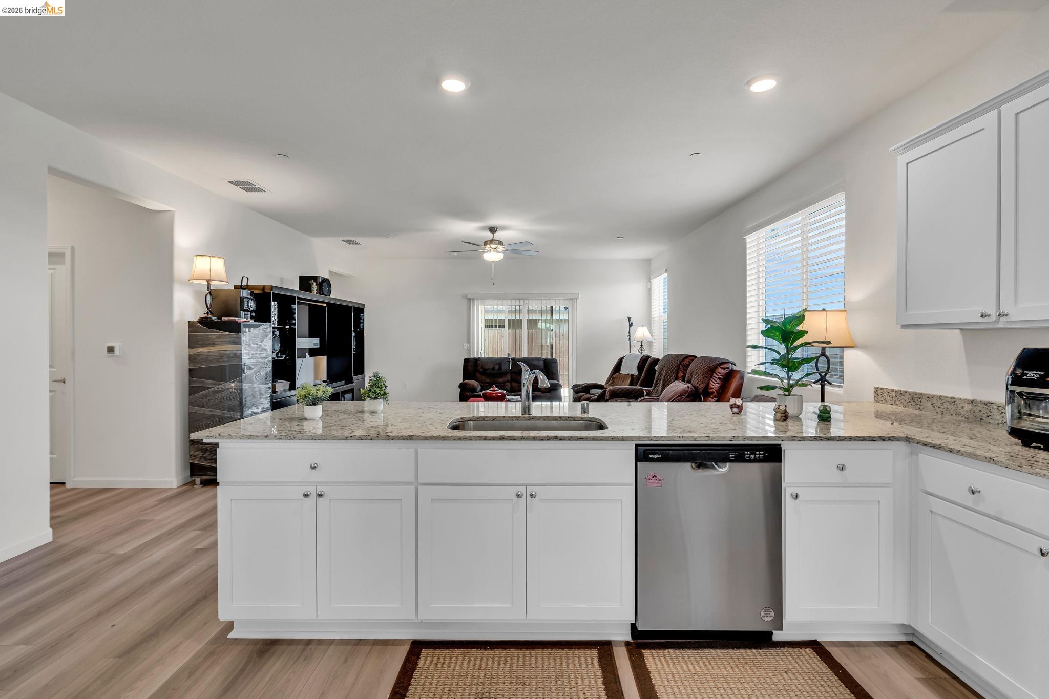 2087 Stars Drive Rio Vista, CA 94571 - Photo 50 of 51 a kitchen with white cabinets sink and stainless steel appliances