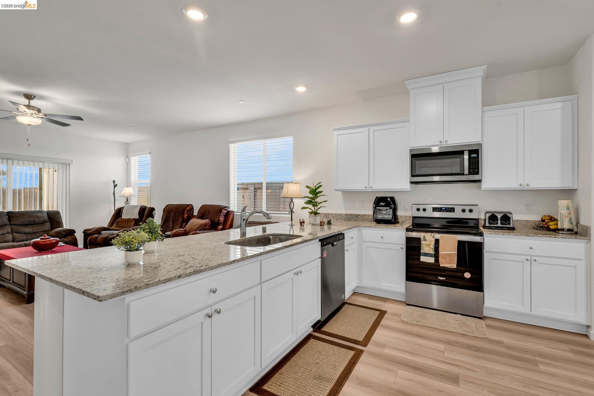 2087 Stars Drive Rio Vista, CA 94571 - Photo 12 of 51 a kitchen with a sink stove and cabinets