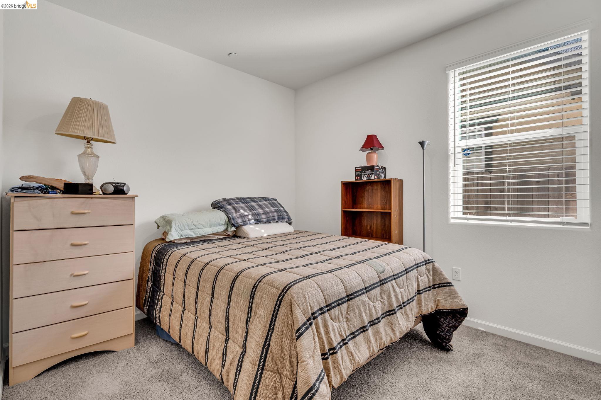 2087 Stars Drive Rio Vista, CA 94571 - Photo 18 of 51 a bedroom with a bed and a window