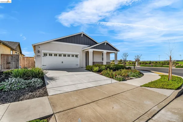 a front view of a house with yard