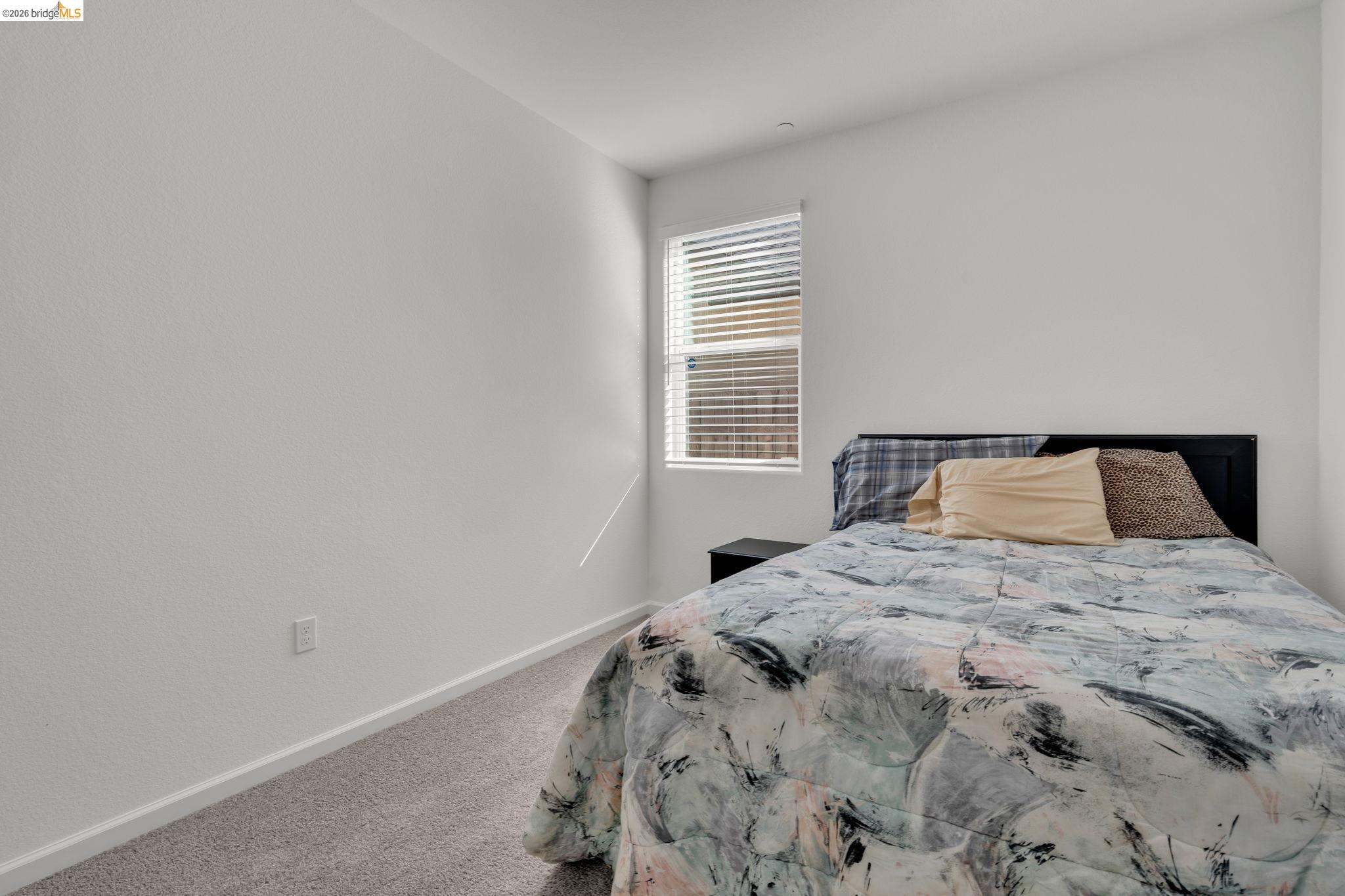2087 Stars Drive Rio Vista, CA 94571 - Photo 23 of 51 a bedroom with a bed and a window