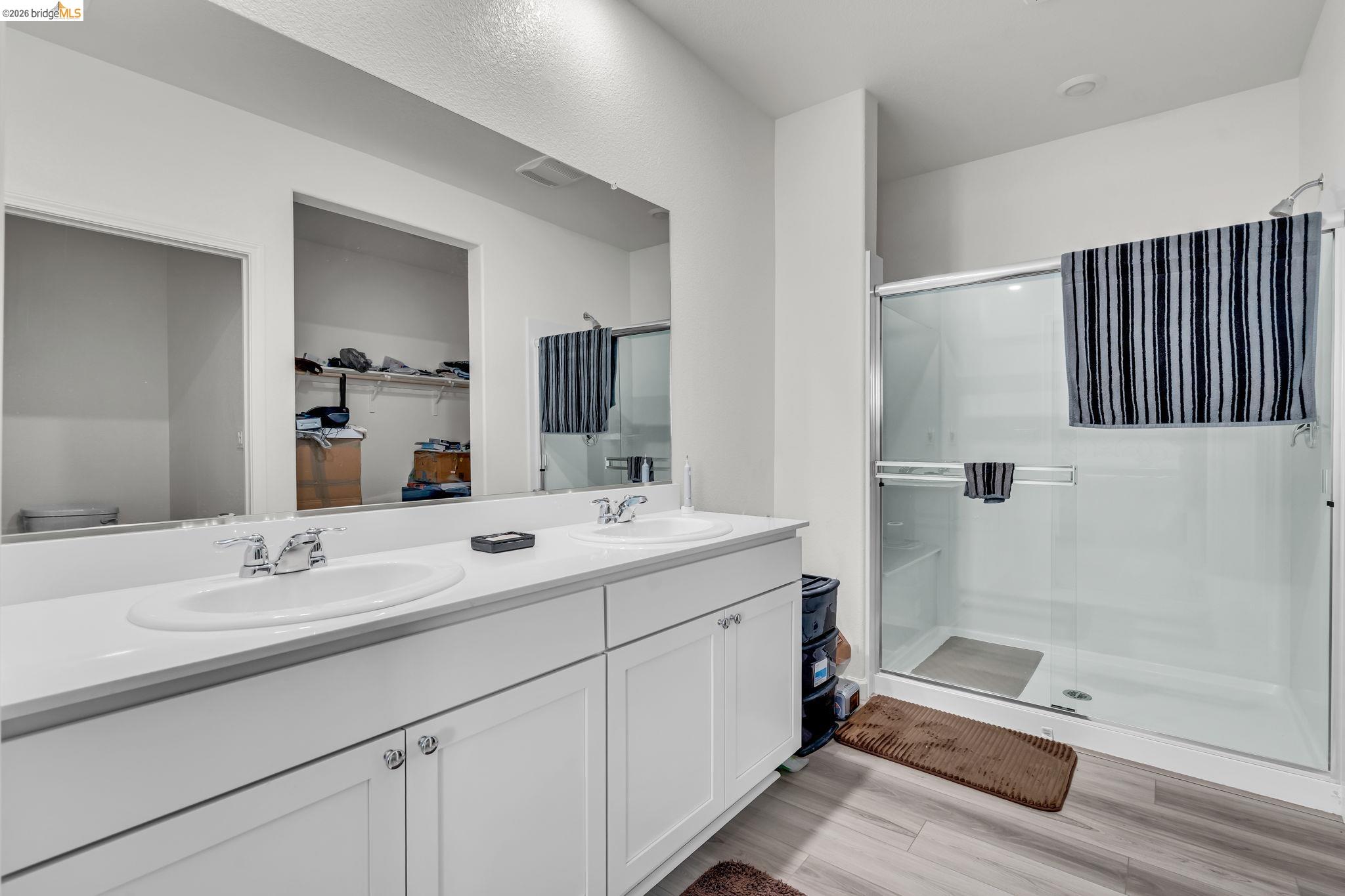 2087 Stars Drive Rio Vista, CA 94571 - Photo 26 of 51 a bathroom with a double vanity sink a mirror and a bathtub