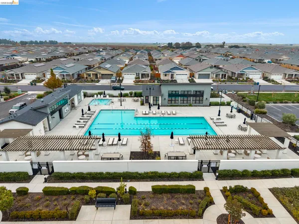 a view of swimming pool with outdoor seating