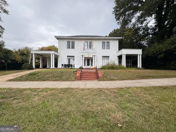 a front view of a house with a yard