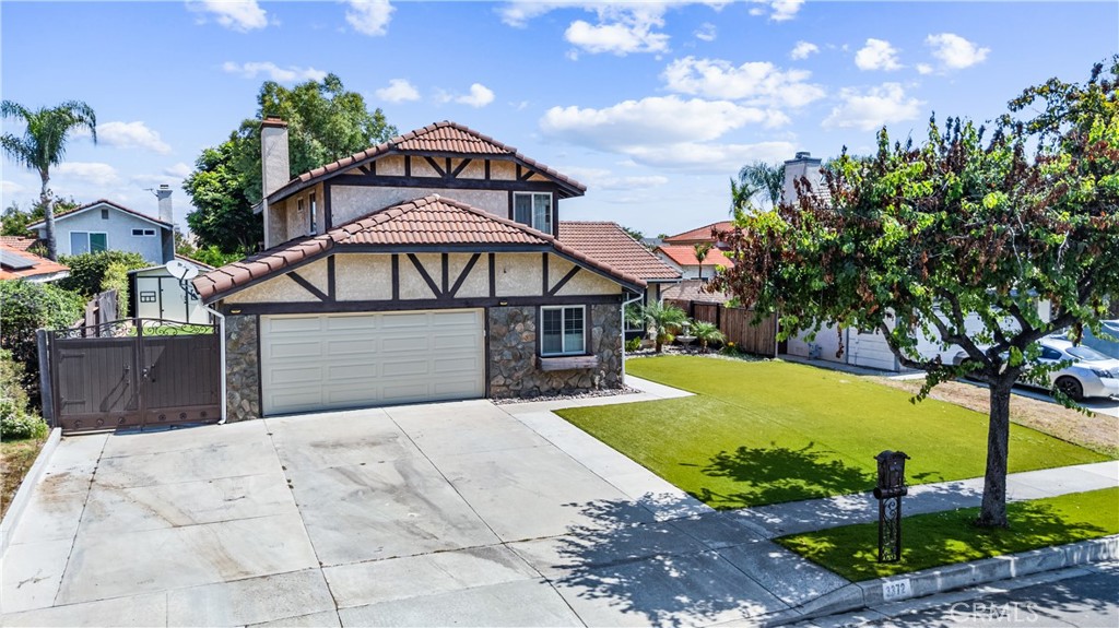 3372 Buckingham Road Chino Hills, CA 91709 - Photo 1 of 1 a front view of a house with a yard and garage