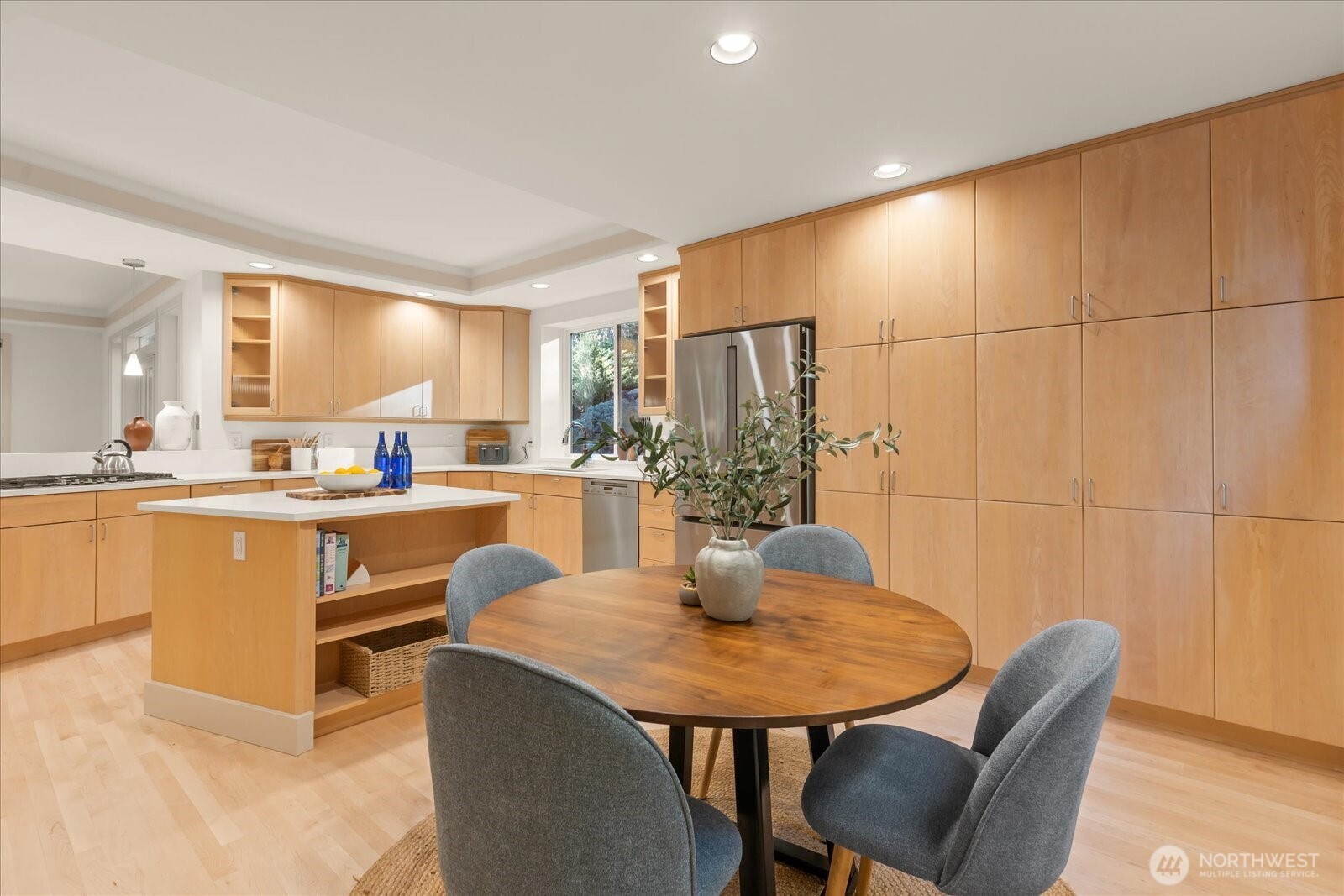 2290 140th Way Southeast Bellevue, WA 98007 - Photo 16 of 39 a kitchen with a table chairs and a refrigerator