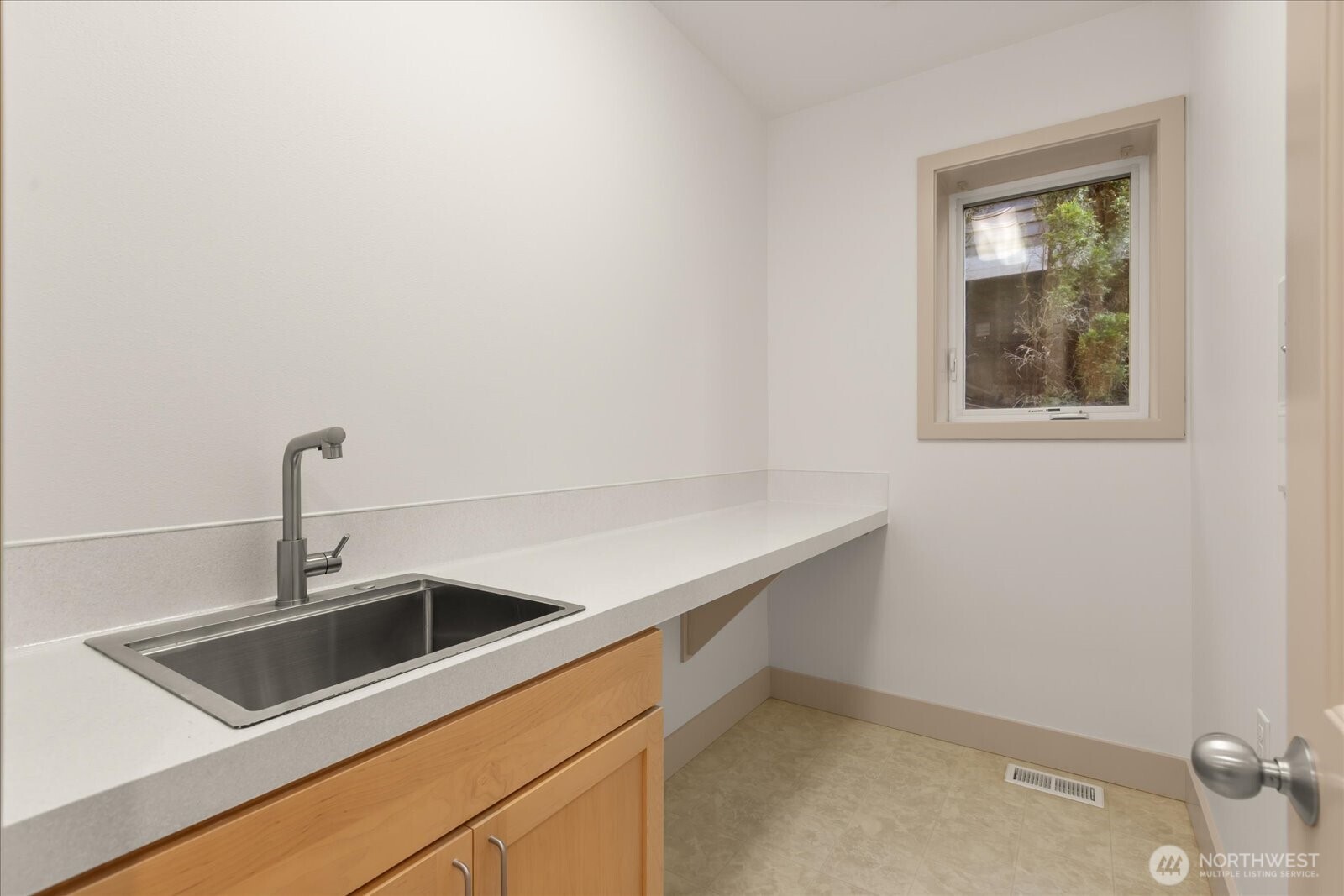 2290 140th Way Southeast Bellevue, WA 98007 - Photo 18 of 39 a kitchen with a sink and cabinets
