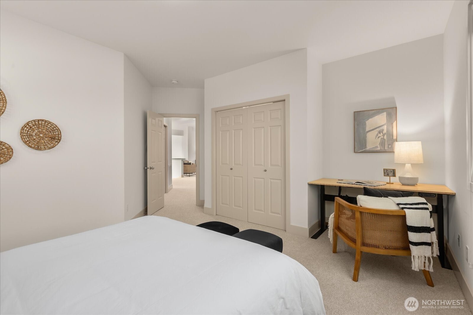 2290 140th Way Southeast Bellevue, WA 98007 - Photo 32 of 39 a bedroom with a bed and a table in it