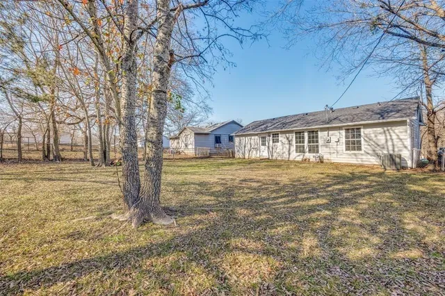 a house with yard in front of it
