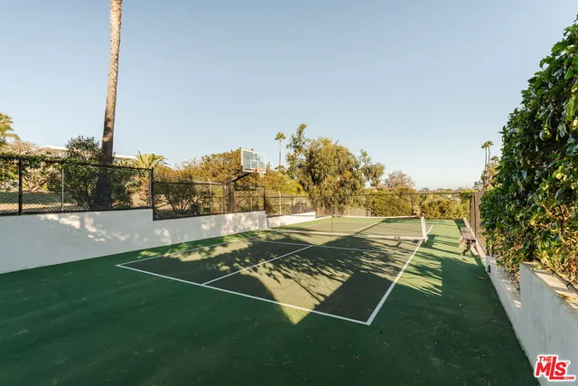 a view of a balcony with furniture and a floor to ceiling window