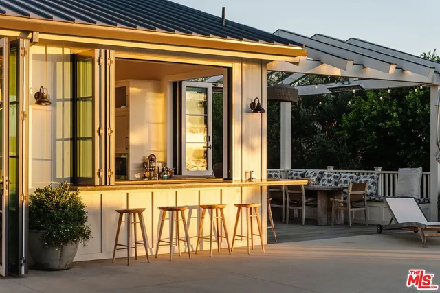 a view of a living room and a balcony