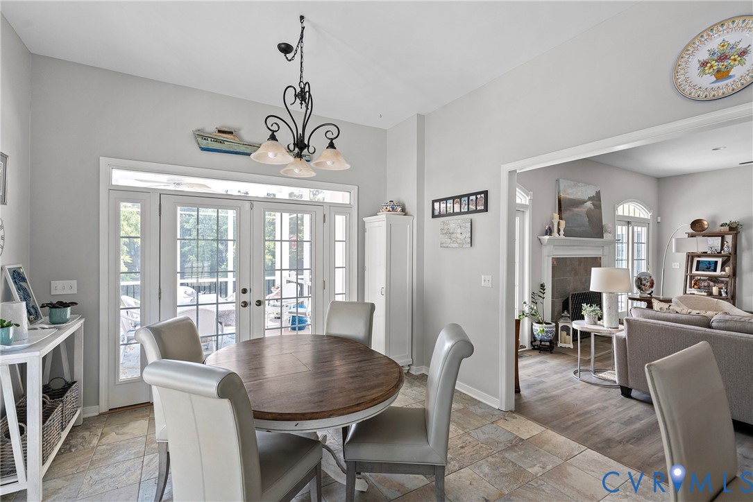 935 Ring Farm Road White Stone, VA 22578 - Photo 19 of 52 Dining area featuring french doors, stone tile flo